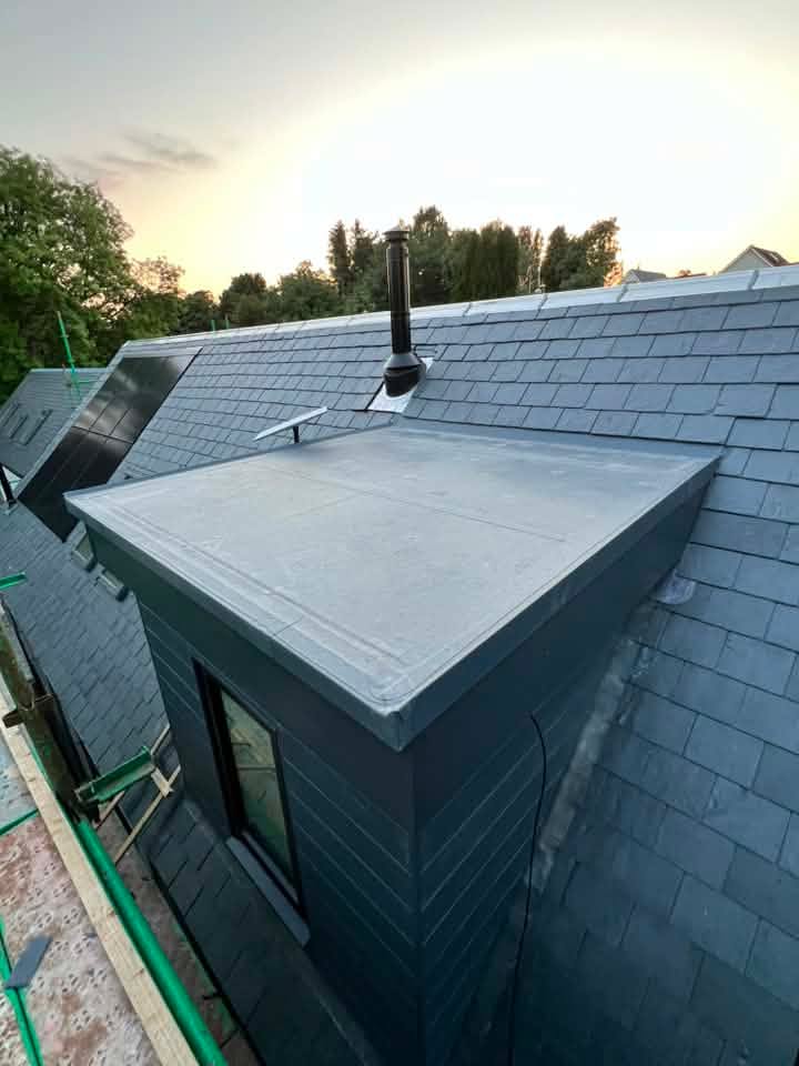 Slate reroof, in-roof solar and flat roofing. A closer view of the dormer flat roof and surrounding slate during the works.